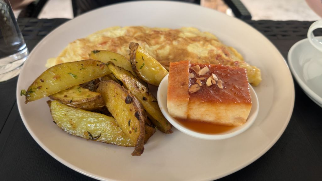 breakfast in fulhadhoo - an omlette with seasonsed potato wedges and a sweet cake